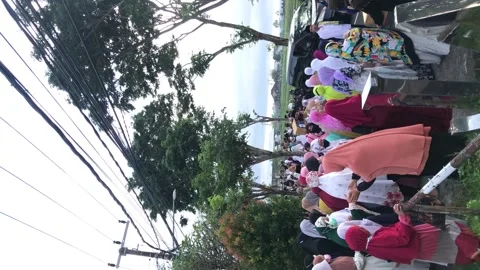 Vertical: Muslims return from the mosque after completing the Eid al-Adha pra Видео 204048802