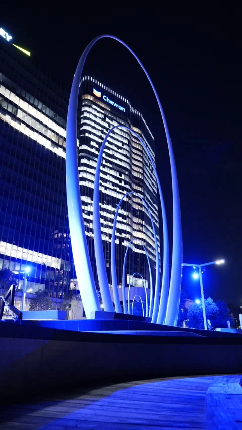 Vertical Neon blue Arches of Spanda Sculpture at night in Perth Australia Stock Footage 311611189