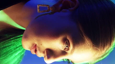 Vertical neon light beauty face contouring woman Stock Footage 292862676