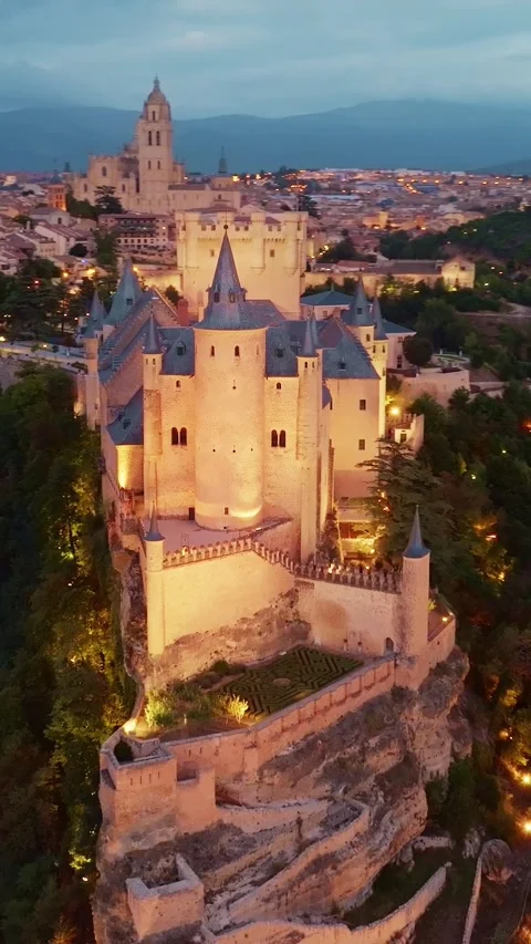 Vertical night aerial view of Cathedral and Alcazar of Segovia, Spain. Drone Video stock 285776085