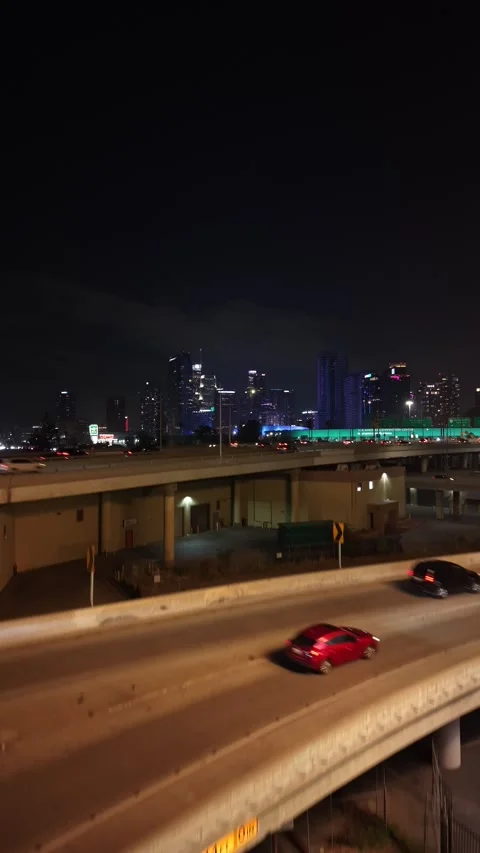 Vertical Night Drone Flyby of Los Angeles Concrete Freeway Overpass Stock Footage 345703243