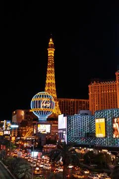 Vertical night shot of the Eiffel Tower in front of the Paris Hotel and Casino Stock Photos