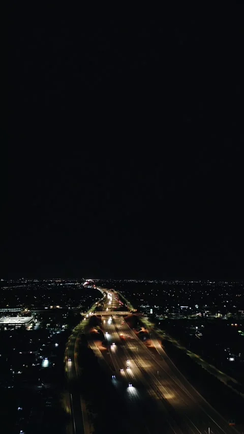 VERTICAL NIGHT SKY WITH FREEWAY Stock Footage 248583480