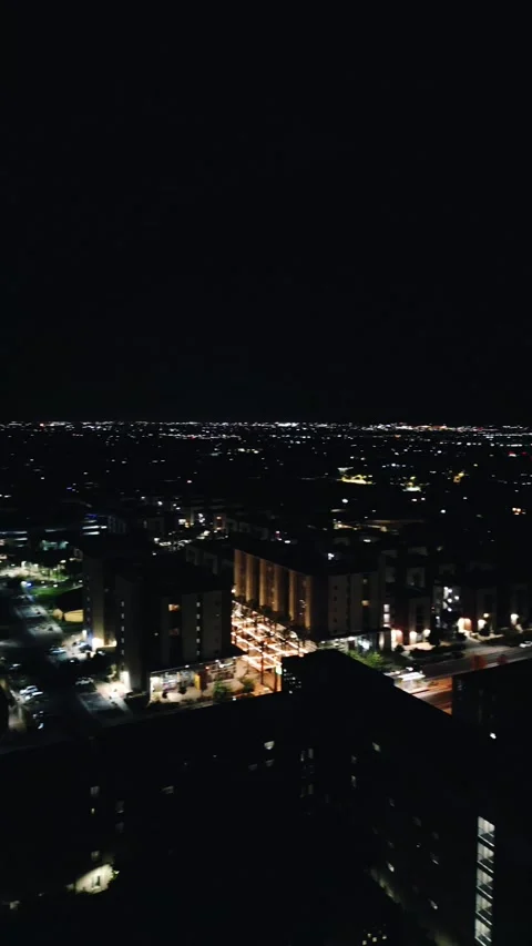 VERTICAL NIGHT TIME LIGHTNING PAN SUBURBAN CITY Stock Footage 248584321