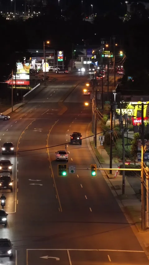 Vertical Night Traffic at a Signalized Intersection Stock Footage 347703047