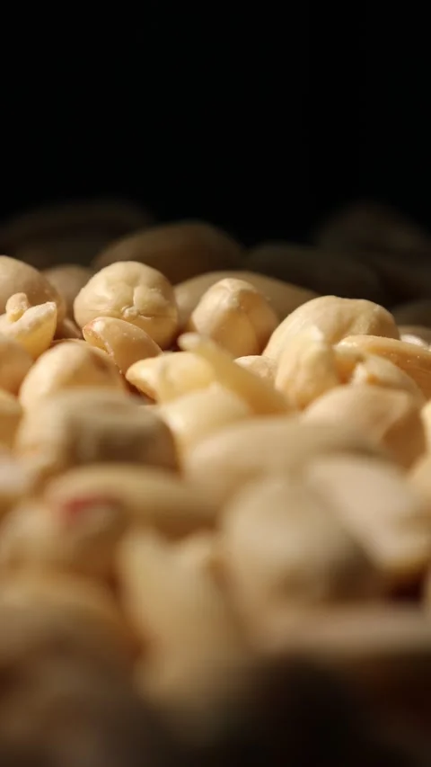 Vertical of nut food on black background Stock Footage 302534657
