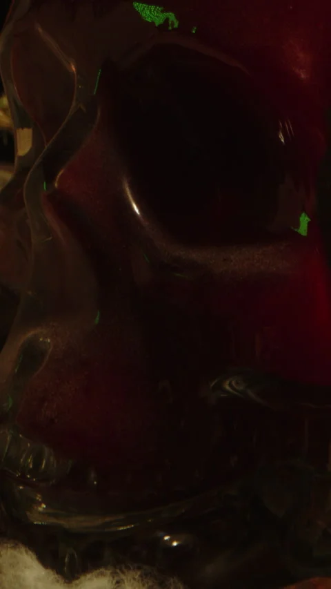 Vertical Occult concept: dolly out of a blood filled glass skull on the altar Stock Footage 336370686