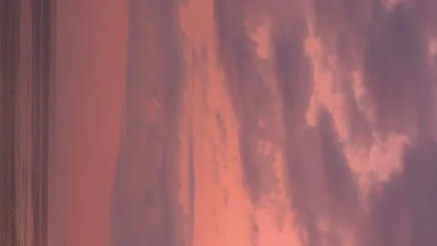 Vertical, Ocean Dramatic Pink Orange Sunset Sky with Storm Purple Cumulus Clouds Stock-Footage 317562832