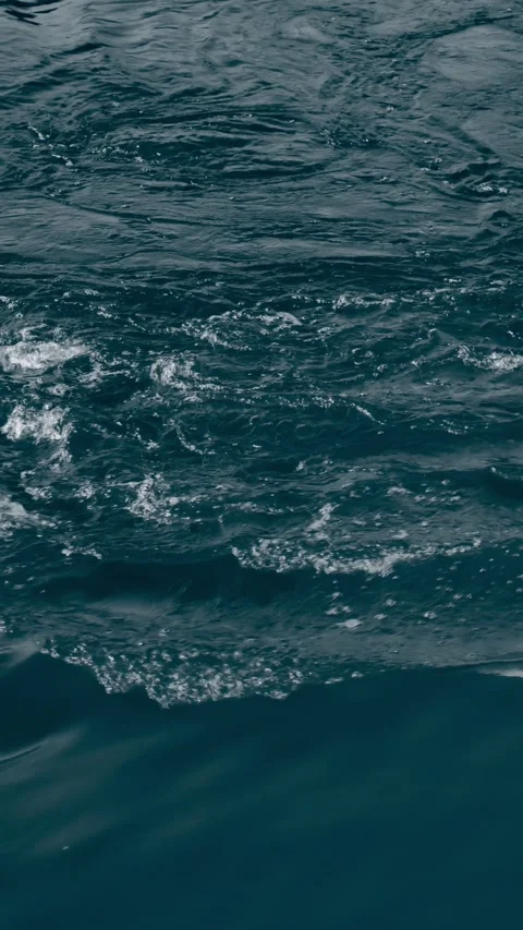 Vertical ocean surface 4K slow motion abstract water background B-roll footage Stock Footage 327665138