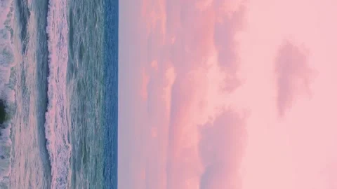 Vertical, Ocean Waves and Amazing Colorful Pink Sunset Sky with Puffy Lilac Pink Stock-Footage 306217004