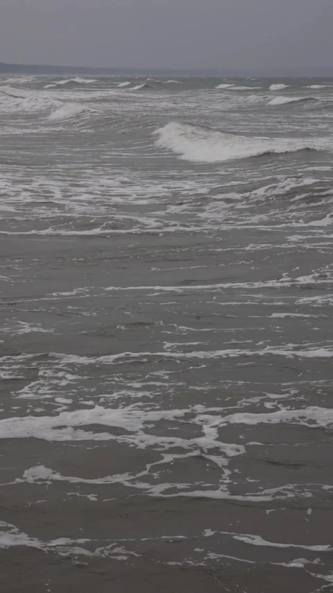 Vertical ocean waves moving and breaking from drone. Vertical aerial ocean waves Stock Footage 329622880