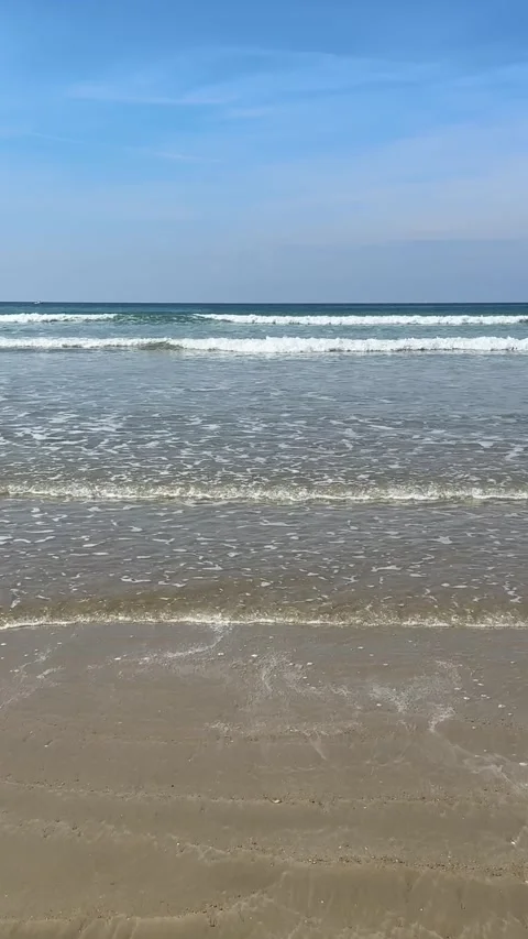 Vertical ocean waves on sandy beach in Brittany France Video stock 334302321
