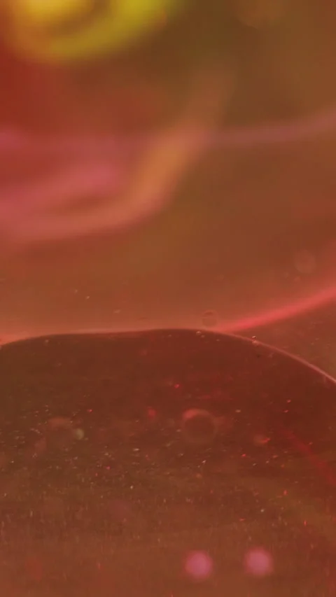 Vertical oil bubble shiny fluid pink ink gel swirl Video stock 288793984