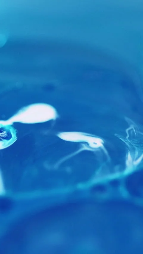 Vertical oil bubbles fizzy liquid blue paint water Stock Footage 311983365