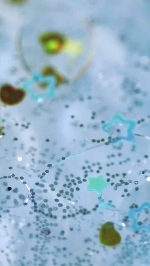 Vertical oil drop liquid shimmer shapes sequins Stock Footage 292045749