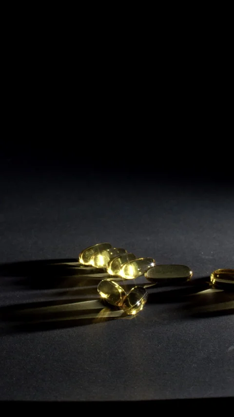 Vertical Omega 3 Softgels Macro with Negative Space Video stock 332369925