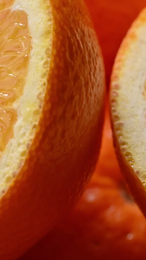 Vertical orange halves macro with juicy citrus texture for mobile use Stock Footage 332218771