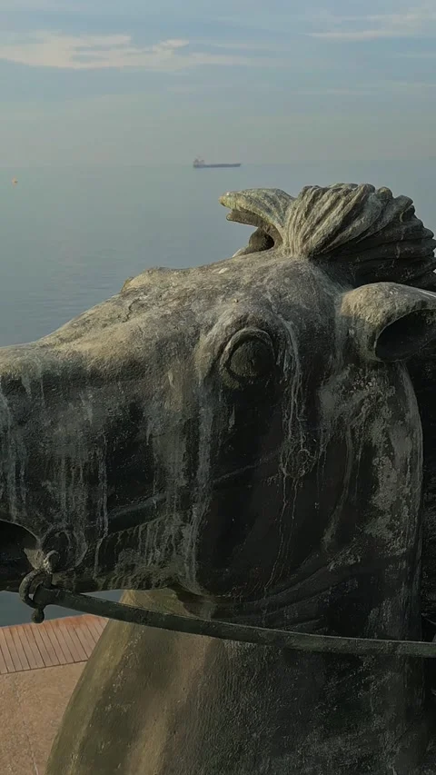 Vertical orbit reveal alexander the Great statue sea 4k Stock-Footage 333820548