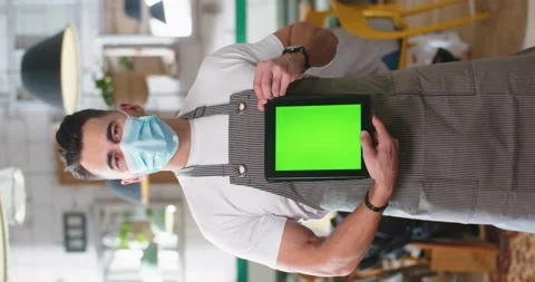 Vertical orientation of happy handsome young Caucasian male employee in medical Stock Footage 152095314