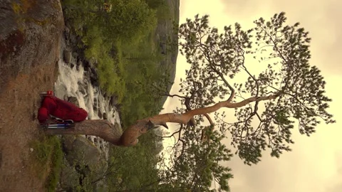 Vertical orientation. Tourist backpack on the background of a mountain river Stock Footage 165402551