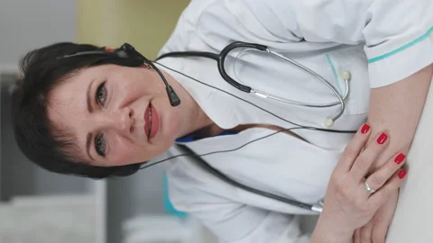Vertical Orientation Video Senior Doctor's Online Medical Consultation Stock Footage 194745351