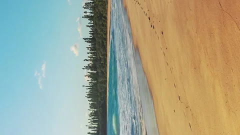 Vertical oriented timelapse of waves on Baie des Rouleaux beach, Isle of Stock Footage 235166697