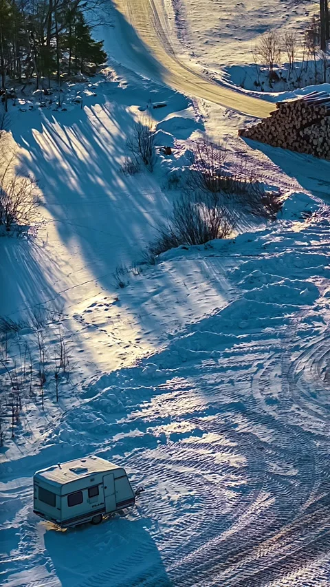 Vertical overhead view of snow landscape with shadows. 動画素材 348791285