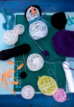 A vertical overhead view of some craft snowmen and some of the tools needed Stock Photos