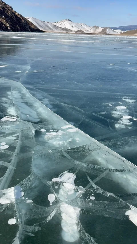 Vertical overview video of frozen Baikal lake in winter cold day Stock Footage 305425853