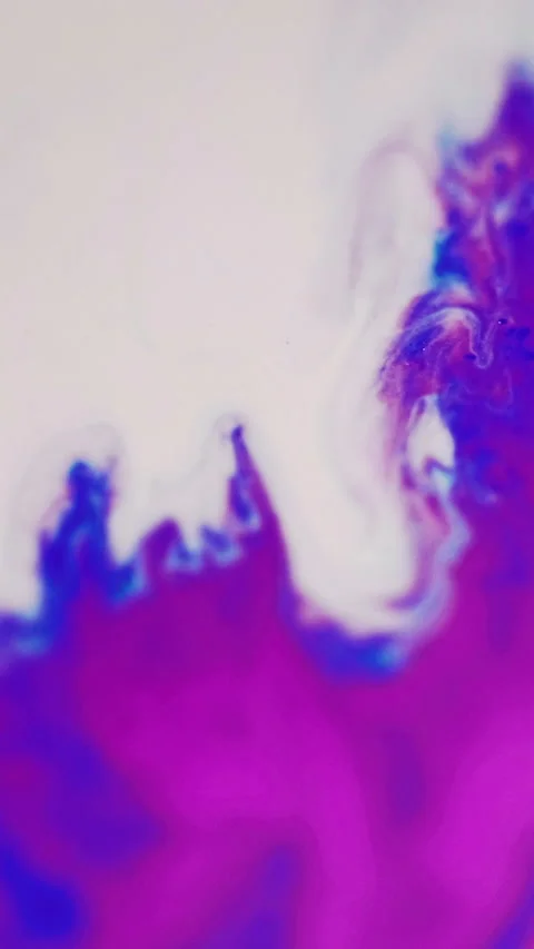 Vertical paint spill color fluid mix purple white Video stock 284055011