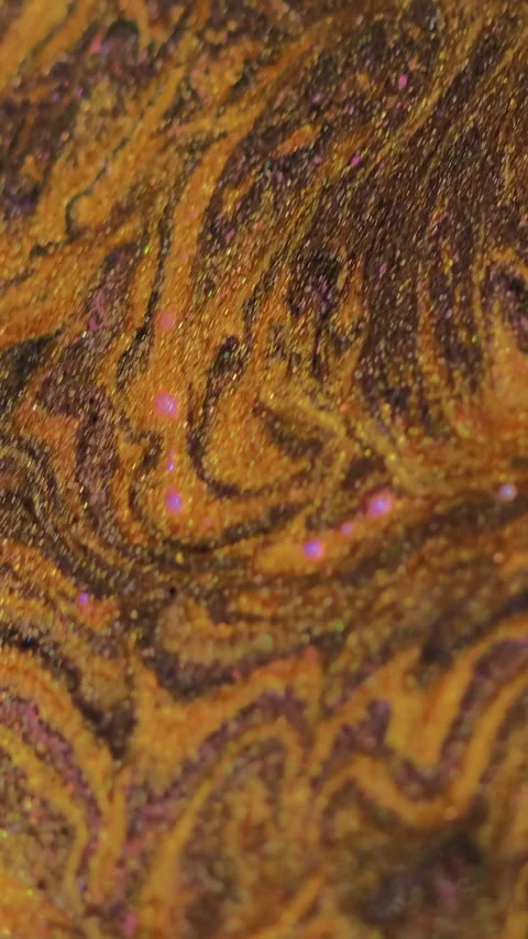 Vertical Paint spill glitter fluid flow golden ink marble Video stock 284654700