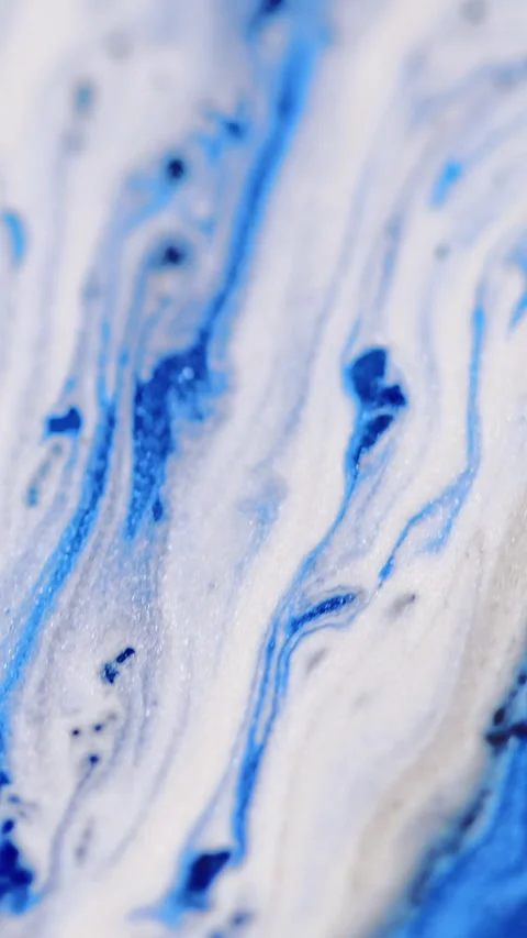 Vertical paint spill glitter ink drip blue white Video stock 284901703