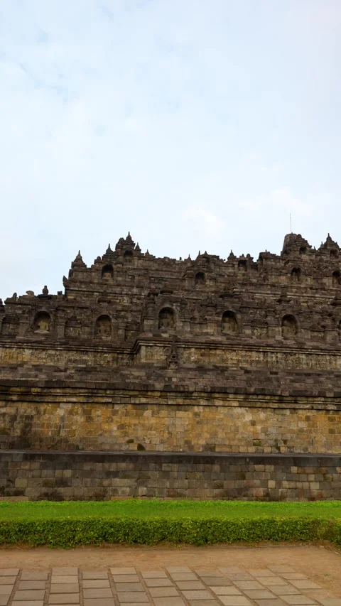 Vertical Pan of Borobudur Temple in Java, Indonesia with Stone Carvings Stock Footage 315116205