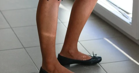 Vertical pan (bottom to top) of a beautiful woman Stock Footage 127070697