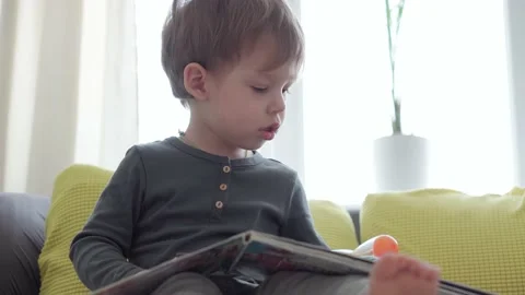Vertical pan close up authentic sick little preschool excited child boy 2-3 Stock Footage 149358291