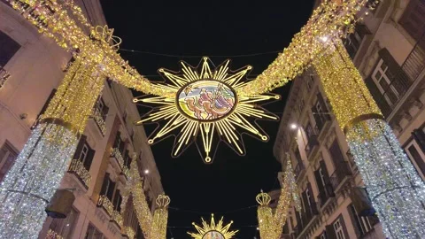 Vertical Pan of Illuminated Ceiling of Larios Street and Historic Buildings Stock Footage 323585233