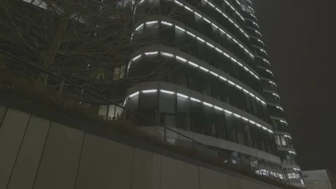 Vertical Pan shot of the office building at night Video stock 147629786