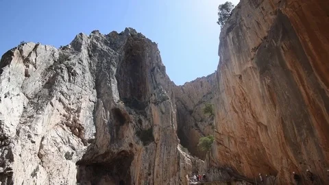 Vertical pan shot of rock cliffs at the famous Caminito Del Rey walkway Stock Footage 74425509