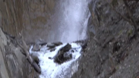 Vertical Pan of Waterfall in Slow Motion. Scenic Nature Footage Stock Footage 303655977