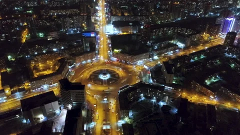 Vertical Panaram drone above night city with circular road with yellow light Stock Footage 101055367