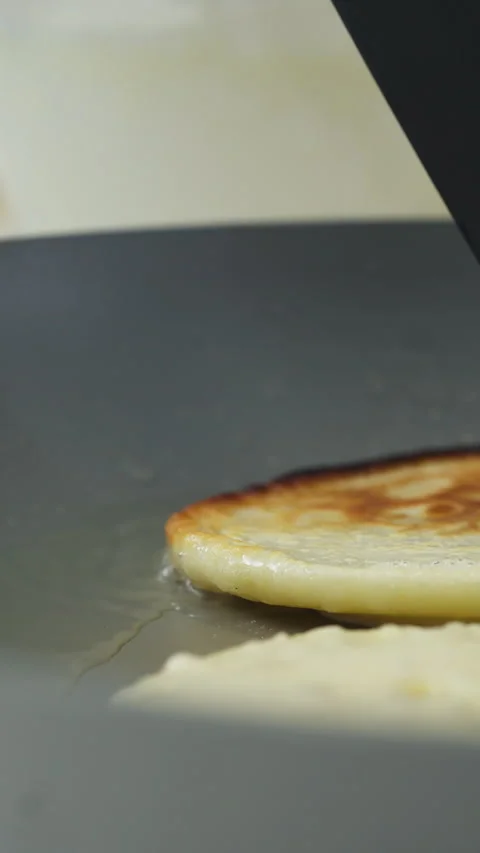 Vertical Of Pancake Flip On A Pan. Close-up Shot Video stock 329087238