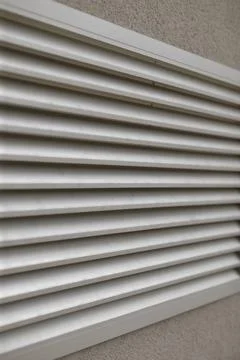 Vertical panel composed of repetitive slats with industrial feel and rhythm Stock Photos