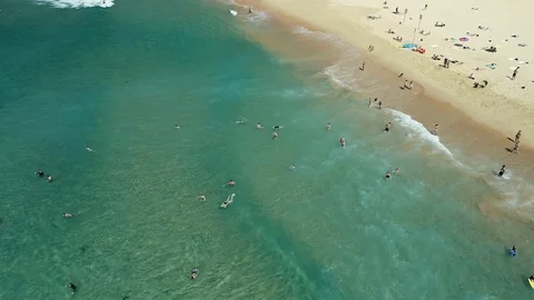 Vertical panning ascent from beach Stock Footage 107076238