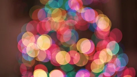 Vertical panning of beautiful out of focus bokeh of a christmas Stock Footage 124805278