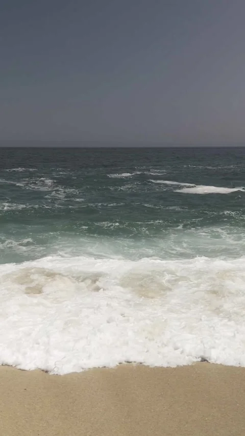 Vertical Panning Sea Waves &amp; Rocks  Stock Footage 285565319