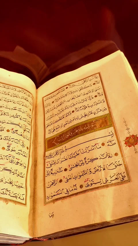 Vertical panning shot of an ancient handwritten Quran. Moving from right to left Video stock 334029468