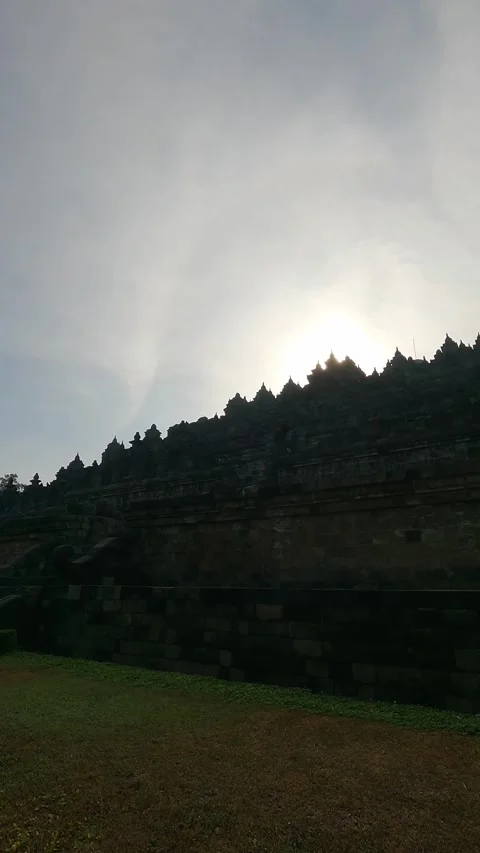 Vertical Panning Shot of Borobudur Temple Silhouette Sunrise Indonesia Stock Footage 338160579