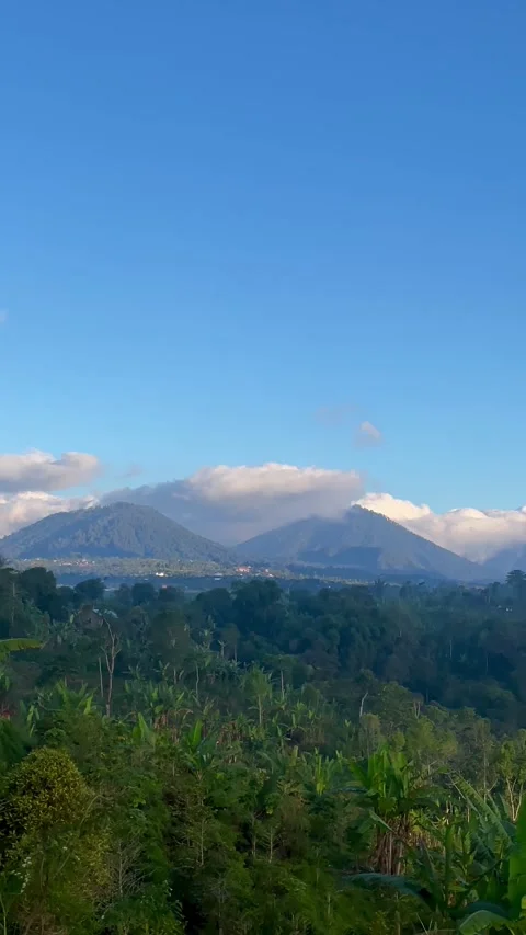 Vertical Panning Shot of Cloud Covered Mountain Range in Bali Stock Footage 341809101