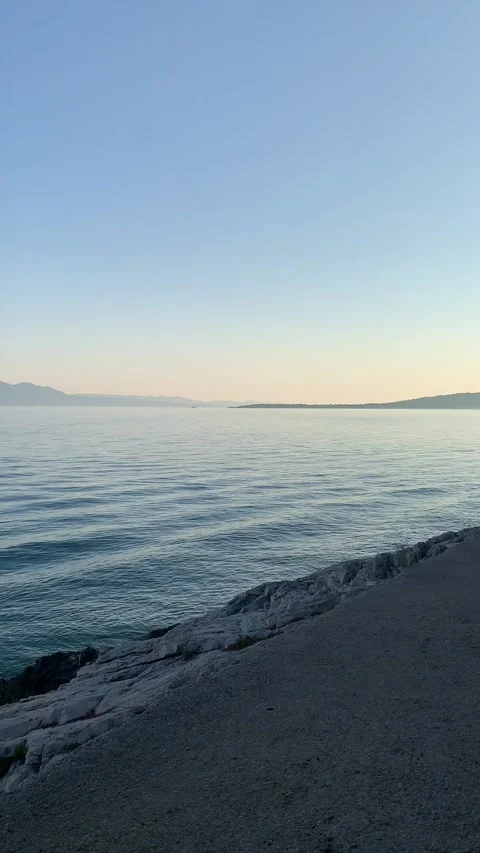 Vertical - Panning View Of Calm Adriatic Sea And Rocky Shore Near Drvenik Видео 345278018