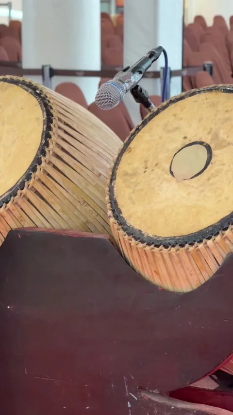 Vertical Panning View Of Traditional Thai Drums With Stage Microphone Stock Footage 345710528